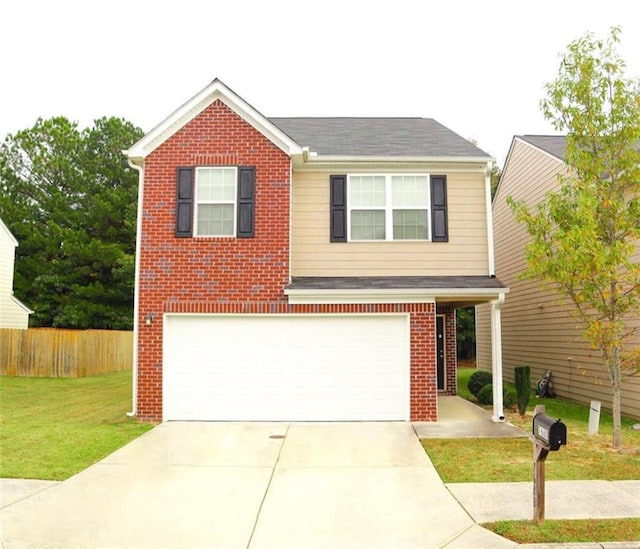 view of front of property featuring a front yard and a garage