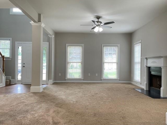 690 Kimball Parc Way, Alpharetta, GA 30022 - unfurnished living room featuring carpet floors, ceiling fan, a fireplace with flush hearth, baseboards, and stairway