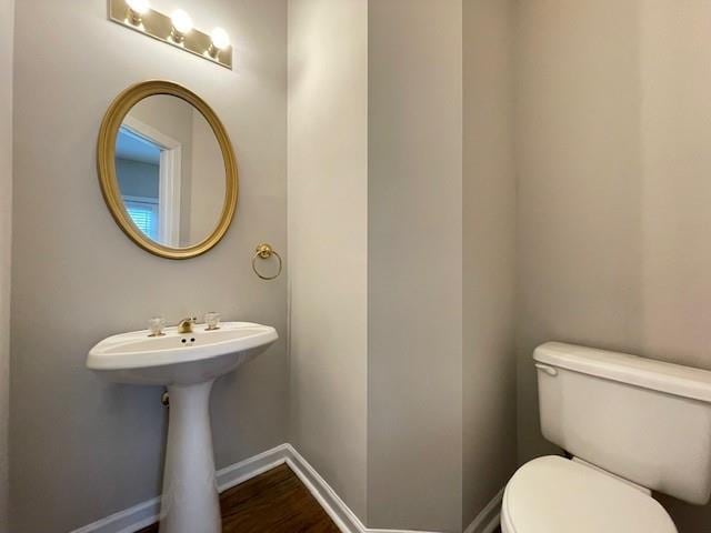 690 Kimball Parc Way, Alpharetta, GA 30022 - half bath featuring toilet, baseboards, and wood finished floors