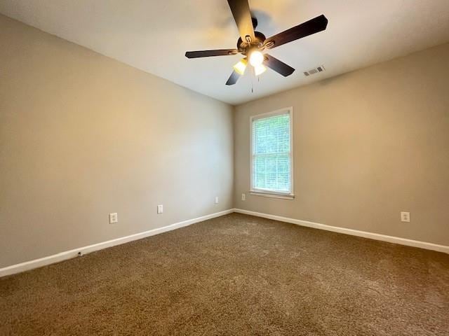 690 Kimball Parc Way, Alpharetta, GA 30022 - spare room featuring baseboards, a ceiling fan, and dark colored carpet