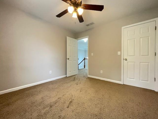 690 Kimball Parc Way, Alpharetta, GA 30022 - unfurnished bedroom featuring carpet, baseboards, and ceiling fan