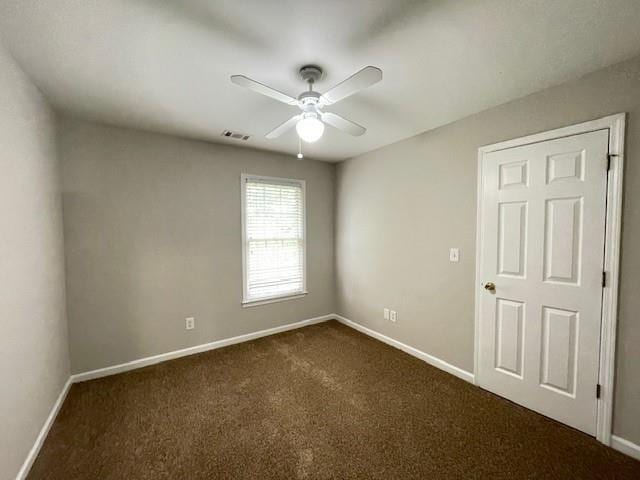 690 Kimball Parc Way, Alpharetta, GA 30022 - empty room with a ceiling fan, dark colored carpet, and baseboards