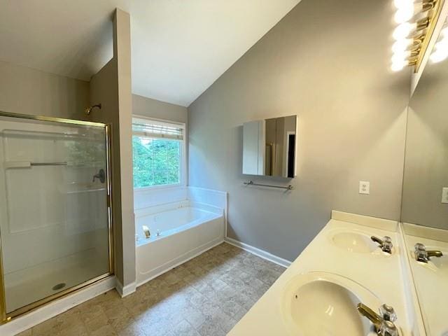 690 Kimball Parc Way, Alpharetta, GA 30022 - full bathroom with lofted ceiling, a bath, a shower stall, baseboards, and double vanity