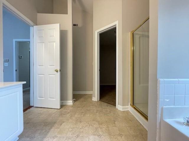690 Kimball Parc Way, Alpharetta, GA 30022 - bathroom featuring a garden tub, a stall shower, vanity, baseboards, and lofted ceiling