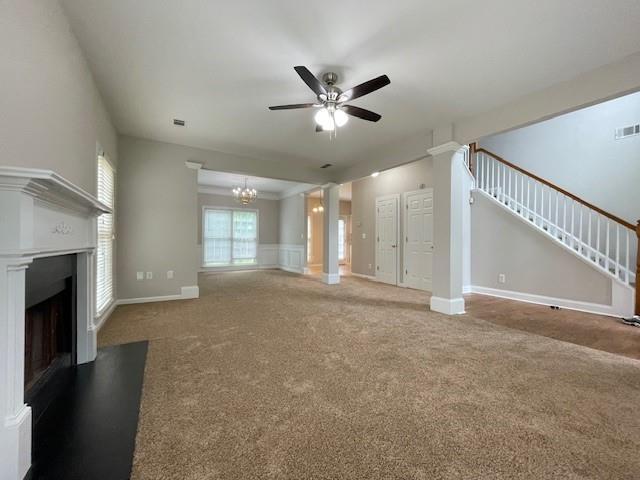 690 Kimball Parc Way, Alpharetta, GA 30022 - unfurnished living room featuring a ceiling fan, stairs, carpet floors, and a fireplace