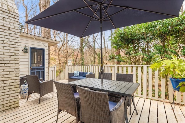 deck with an outdoor living space and outdoor dining area