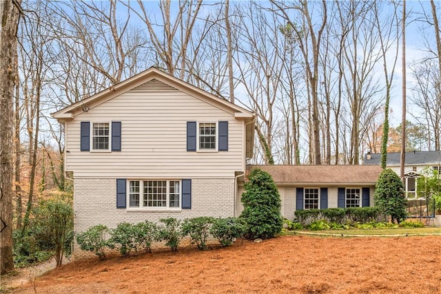 view of front of house with brick siding