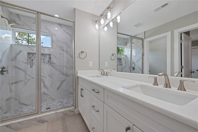 1857 Derrill Dr, Decatur, GA 30032 - bathroom with marble finish floor, visible vents, a sink, and a marble finish shower