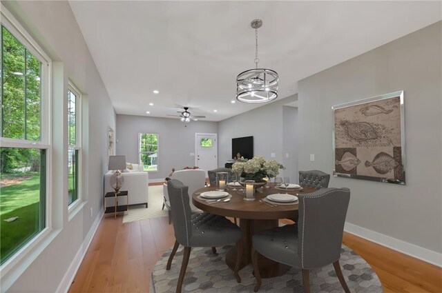 1857 Derrill Dr, Decatur, GA 30032 - dining area featuring ceiling fan with notable chandelier, baseboards, light wood-style floors, and recessed lighting