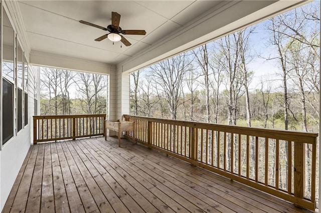 wooden terrace featuring ceiling fan