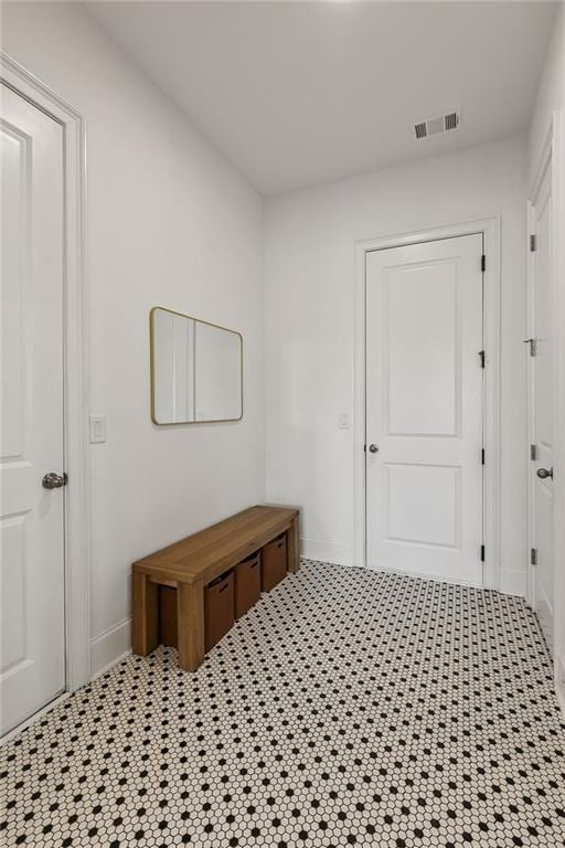 interior space with visible vents and baseboards