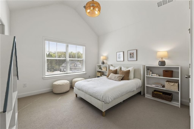 carpeted bedroom featuring baseboards, visible vents, and vaulted ceiling