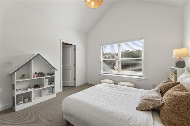 carpeted bedroom with baseboards and high vaulted ceiling