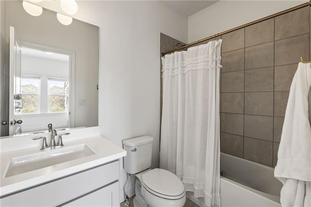 bathroom featuring toilet, vanity, and shower / bath combo