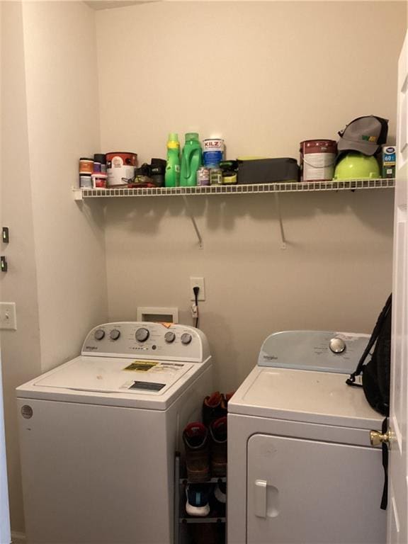 washroom featuring washer and dryer and laundry area