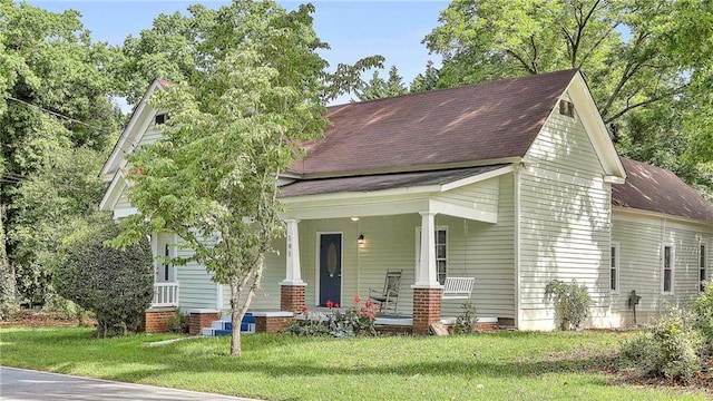 view of front of house featuring a front lawn and a porch