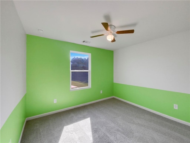 carpeted empty room with ceiling fan