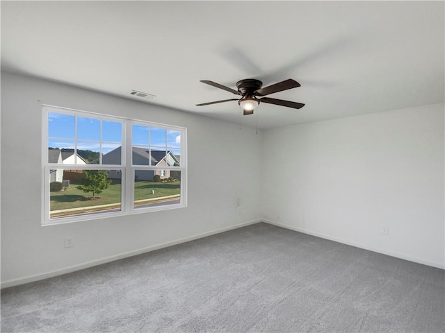 spare room with ceiling fan and carpet floors