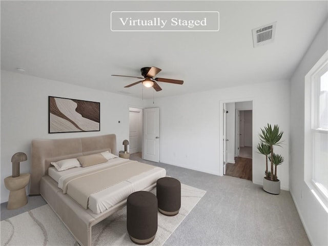 carpeted bedroom with ceiling fan