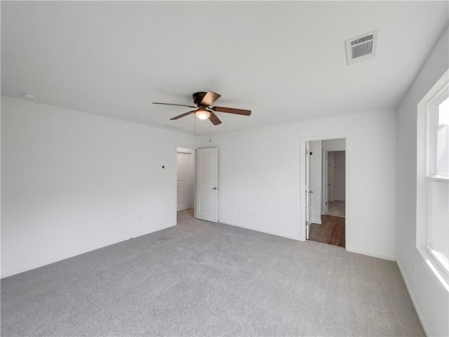 unfurnished bedroom featuring ceiling fan and carpet flooring