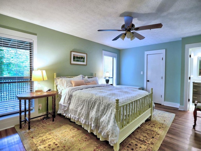 2210 Cumberland Ct SE, Smyrna, GA 30080 - bedroom featuring wood finished floors, baseboards, a textured ceiling, and ceiling fan