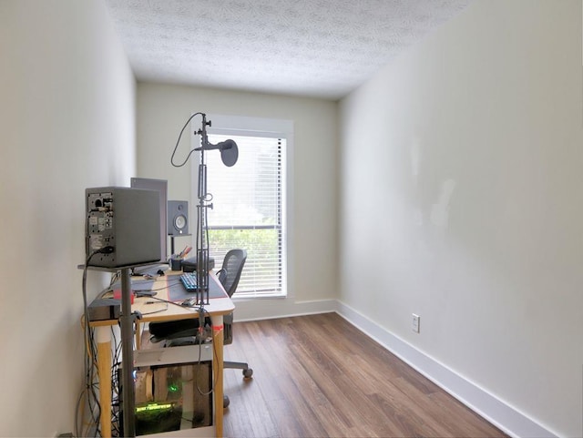2210 Cumberland Ct SE, Smyrna, GA 30080 - office featuring wood finished floors, plenty of natural light, a textured ceiling, and baseboards