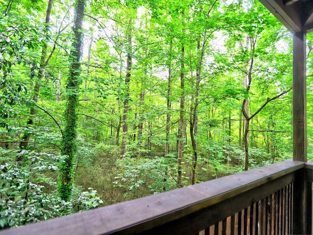 2210 Cumberland Ct SE, Smyrna, GA 30080 - balcony featuring a wooded view