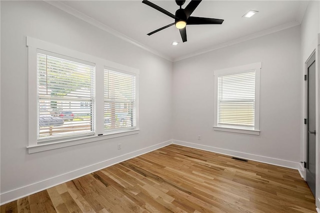 unfurnished room featuring ceiling fan, crown molding, and hardwood / wood-style floors