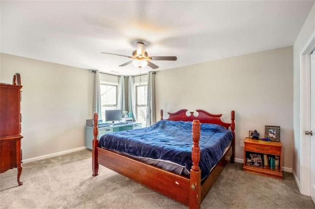 bedroom with ceiling fan, carpet, and baseboards