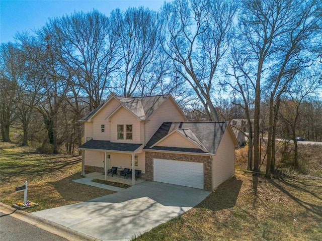 view of front of property with a front yard, driveway, and an attached garage