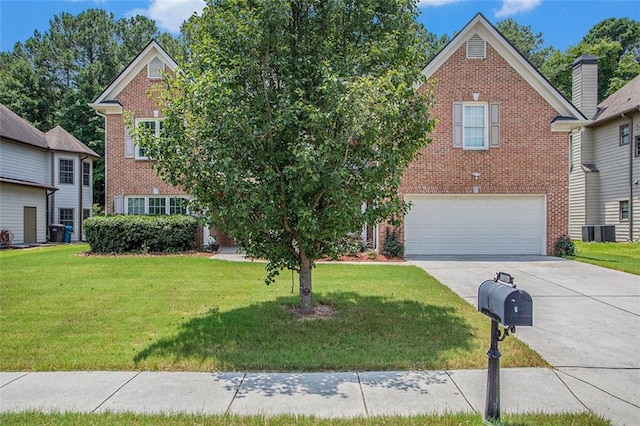 view of front of house with a garage and a front yard