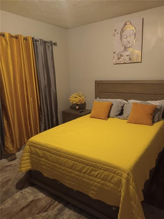 bedroom featuring a textured ceiling