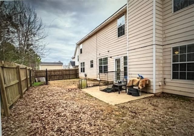 back of house with a patio