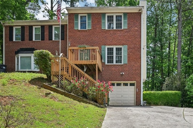 187 Timber Creek Ln SW, Marietta, GA 30060 - view of front of property with a garage, driveway, a chimney, brick siding, and stairs