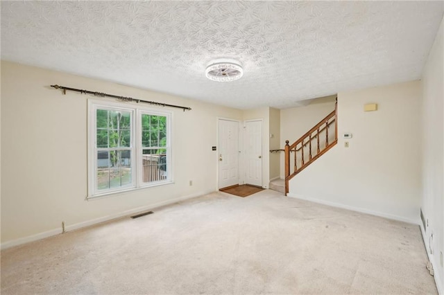 187 Timber Creek Ln SW, Marietta, GA 30060 - entryway with a textured ceiling, stairs, carpet, and baseboards