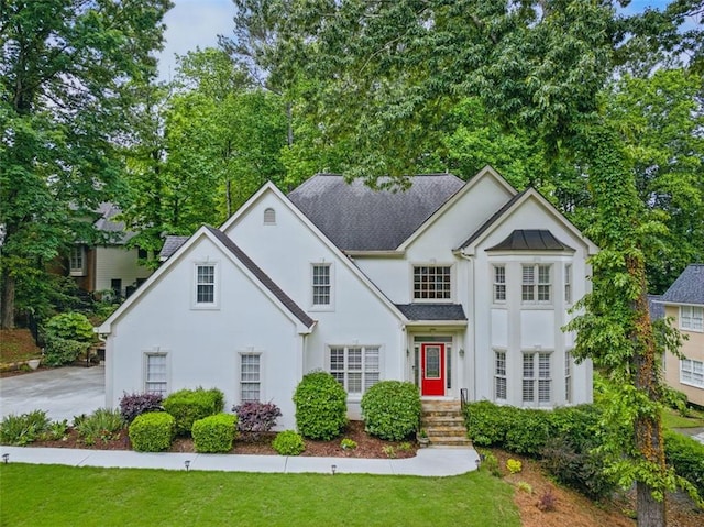 10000 Groomsbridge Rd, Johns Creek, GA 30022 - view of front of home with stucco siding, a front yard, and a shingled roof