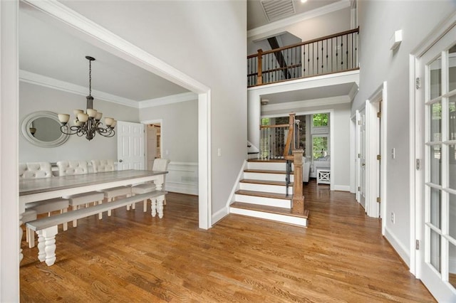 10000 Groomsbridge Rd, Johns Creek, GA 30022 - foyer featuring stairs, a chandelier, light wood finished floors, ornamental molding, and baseboards