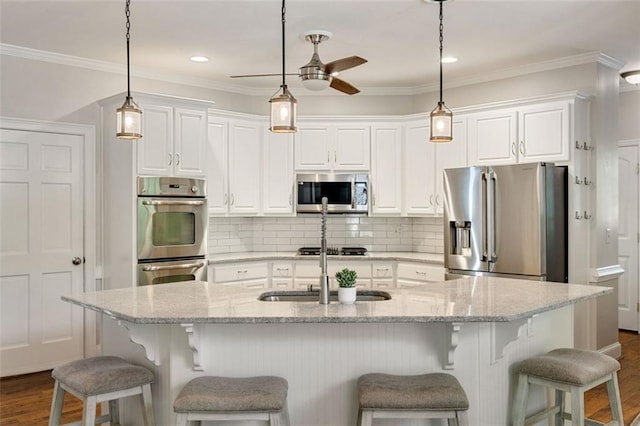 10000 Groomsbridge Rd, Johns Creek, GA 30022 - kitchen with stainless steel appliances, a sink, dark wood-type flooring, a ceiling fan, and white cabinets