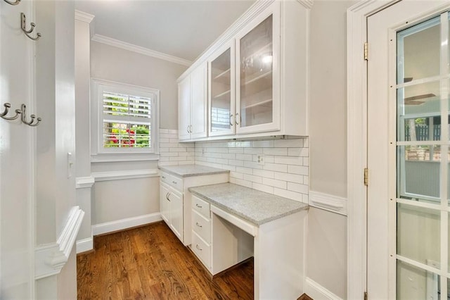10000 Groomsbridge Rd, Johns Creek, GA 30022 - kitchen with ornamental molding, dark wood-style floors, glass insert cabinets, tasteful backsplash, and white cabinetry
