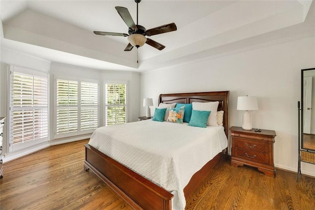 10000 Groomsbridge Rd, Johns Creek, GA 30022 - bedroom featuring a raised ceiling, wood finished floors, and a ceiling fan