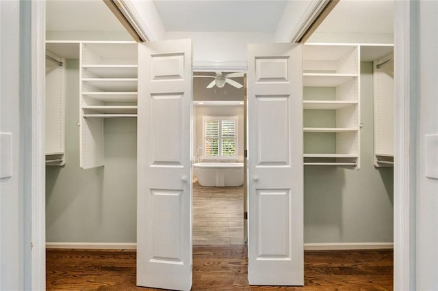 10000 Groomsbridge Rd, Johns Creek, GA 30022 - spacious closet featuring wood finished floors and a ceiling fan