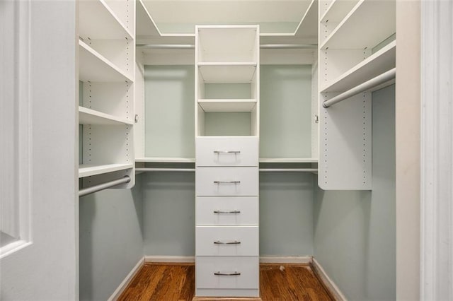 10000 Groomsbridge Rd, Johns Creek, GA 30022 - walk in closet with dark wood-style floors