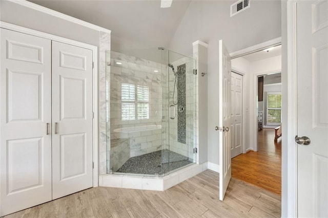 10000 Groomsbridge Rd, Johns Creek, GA 30022 - full bathroom featuring wood finished floors, a stall shower, vaulted ceiling, and baseboards
