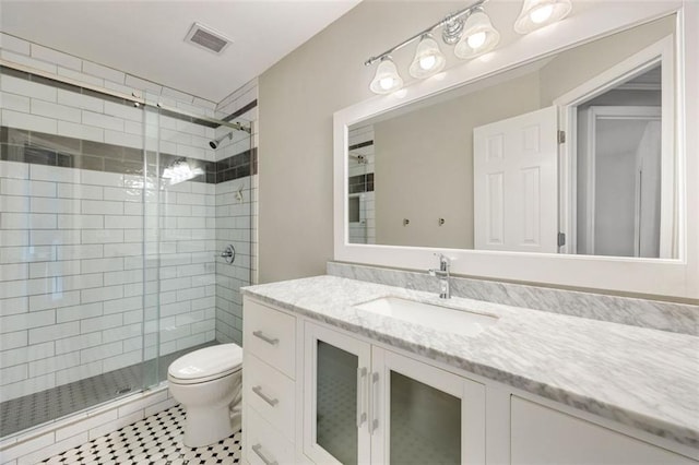 10000 Groomsbridge Rd, Johns Creek, GA 30022 - bathroom with toilet, a shower stall, vanity, and tile patterned floors
