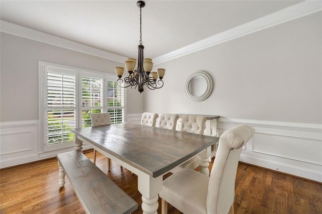 10000 Groomsbridge Rd, Johns Creek, GA 30022 - dining area with a chandelier, crown molding, wainscoting, a decorative wall, and wood finished floors