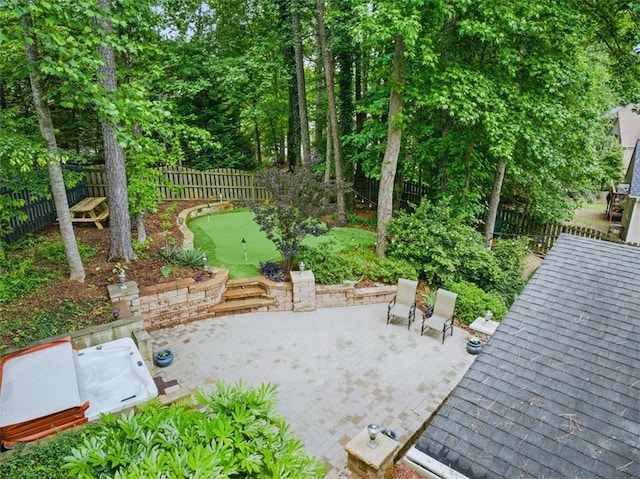 10000 Groomsbridge Rd, Johns Creek, GA 30022 - fenced backyard featuring a putting area and a patio