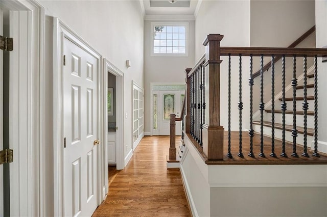 10000 Groomsbridge Rd, Johns Creek, GA 30022 - entrance foyer featuring wood finished floors, a towering ceiling, ornamental molding, stairs, and baseboards