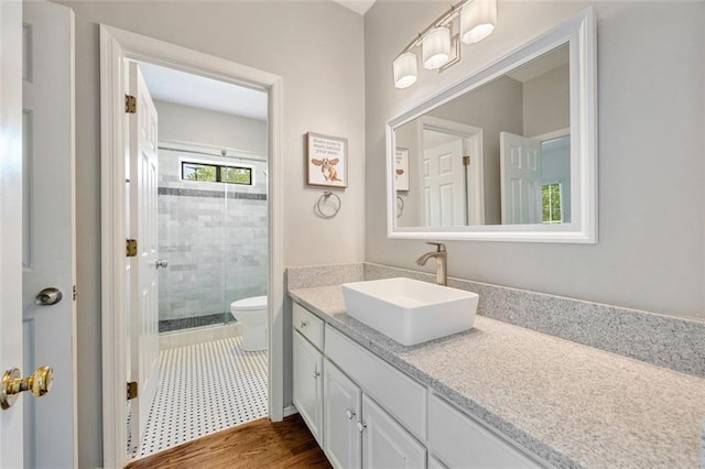 10000 Groomsbridge Rd, Johns Creek, GA 30022 - full bath with toilet, vanity, a stall shower, and wood finished floors