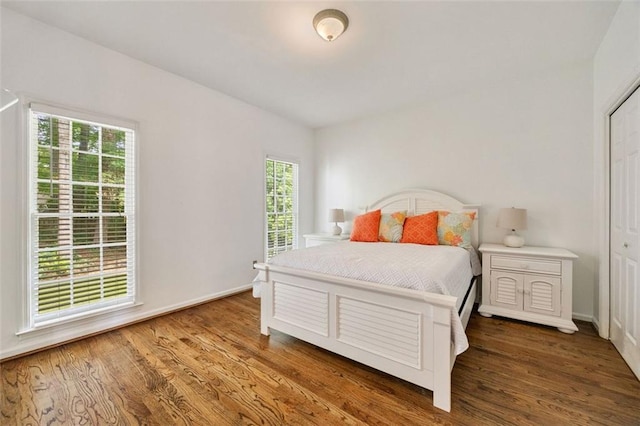 10000 Groomsbridge Rd, Johns Creek, GA 30022 - bedroom featuring multiple windows, wood finished floors, and baseboards