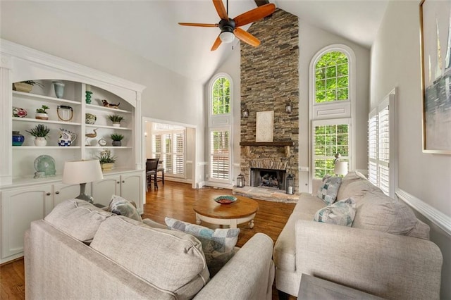 10000 Groomsbridge Rd, Johns Creek, GA 30022 - living area featuring high vaulted ceiling, ceiling fan, wood finished floors, a fireplace, and baseboards